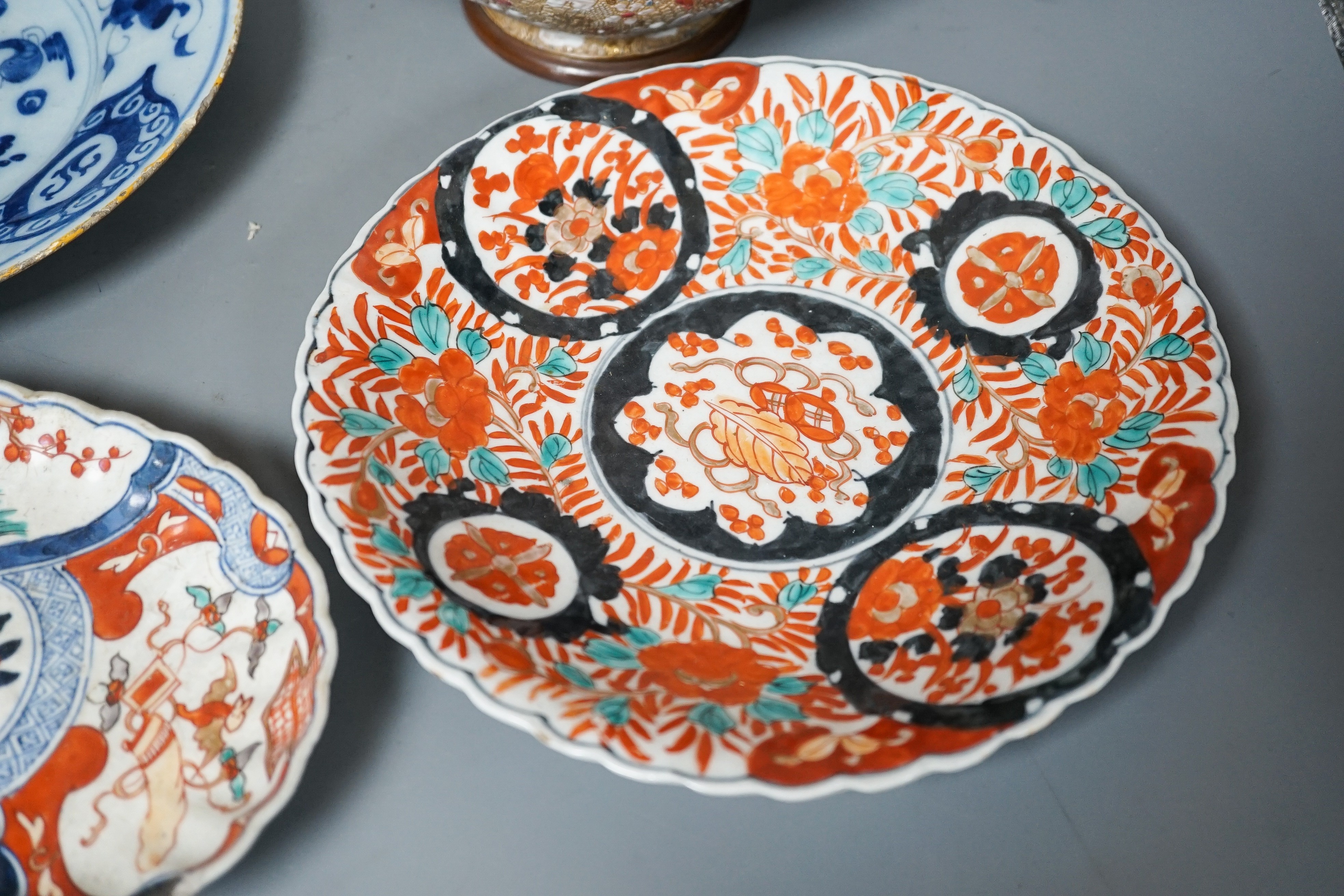 A Doulton slaters patent vase, height 40cm, two Imari dishes and an 18th century Delft blue and white plate